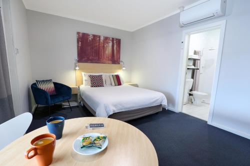 Postel nebo postele na pokoji v ubytování Nebula Motel