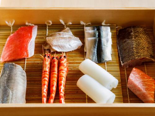 a box filled with different types of fish and seafood at Hyatt Regency Seragaki Island Okinawa in Onna