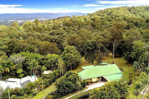 an aerial view of a house with a green roof at Noosa hinterland acreage close to the beach in Ninderry