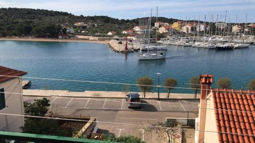 a view of a marina with boats in the water at Iris in Jezera