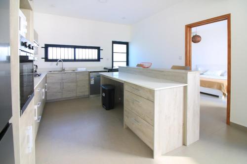 a kitchen with a sink and a counter top at Villa Cardinal, 4 chambres avec piscine privee in Pointe aux Biches