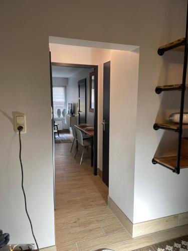 a hallway leading into a living room with a table at Excellent house in Ediger-Eller