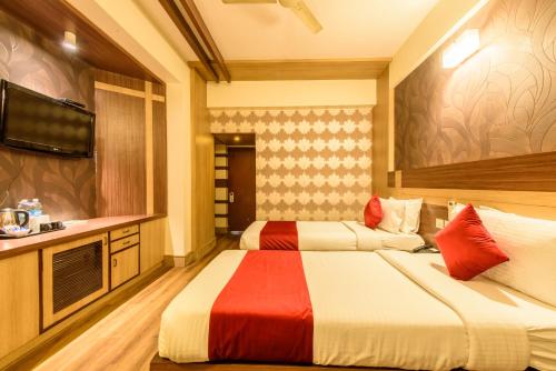 Un ou plusieurs lits dans un hébergement de l'établissement Bangalore Gate Hotel & Conferences
