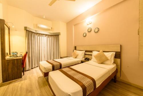 Un ou plusieurs lits dans un hébergement de l'établissement Bangalore Gate Hotel & Conferences