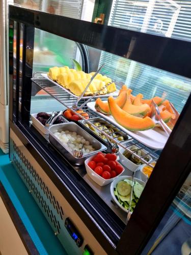 a buffet with many different types of fruits and vegetables at Hotel Orchidea in Lignano Sabbiadoro