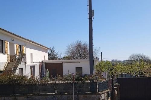 a white house with a fence in front of it at Casa María VUT 5614 AS in Villaviciosa