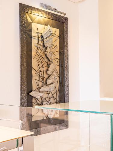 a glass table in front of a fireplace at White dreams in Portovenere