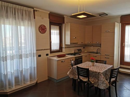 A kitchen or kitchenette at NSM Casa di Fulmine attico con box privato