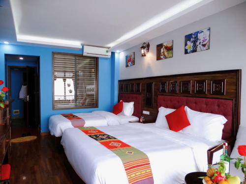 Postel nebo postele na pokoji v ubytování Sapa Hills Hotel