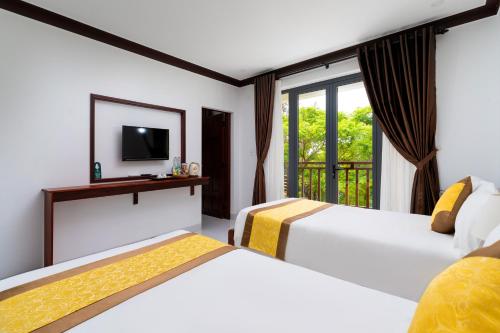 Haemer Villa Hoi Anにあるベッド