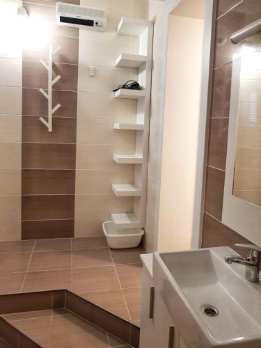 a bathroom with a toilet and a sink at Apartmani Vrančić - Sea View & Free Parking in Mandre