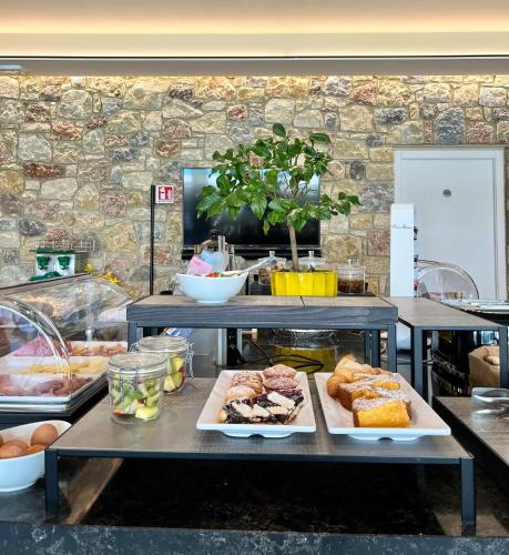 a bakery with many different types of pastries on display at Relais Limonaia - Suites & Garden SPA in Torri del Benaco