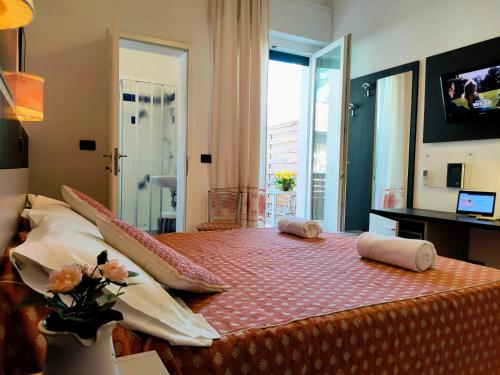 Een bed of bedden in een kamer bij Hotel Mon Reve