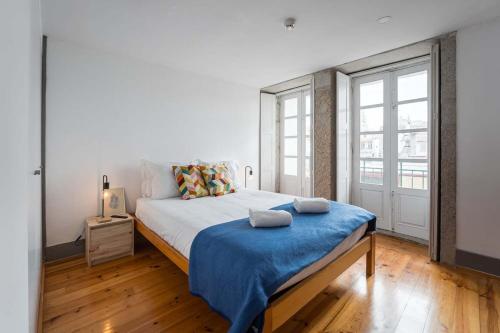 Posteľ alebo postele v izbe v ubytovaní Panorama Apartments Porto Clerigos