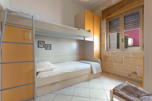 Ліжко або ліжка в номері Villetta Monica by BarbarHouse