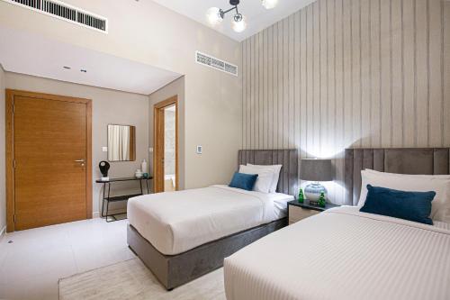 Postel nebo postele na pokoji v ubytování Luxury Oasis 2 Bed in Downtown 7 mins to Dubai Mall
