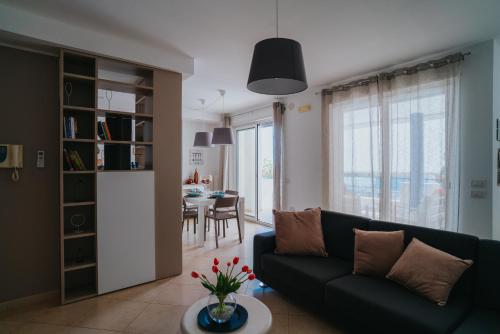 a living room with a couch and a table at Dimora Donna Matilde in Polignano a Mare