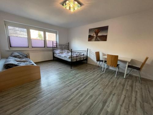 Ένα ή περισσότερα κρεβάτια σε δωμάτιο στο Schöne einfache Ferienwohnungen in Wilhelmshaven