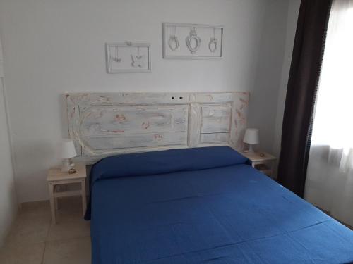 מיטה או מיטות בחדר ב-La Casa di Adi