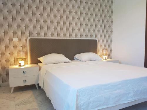 เตียงในห้องที่ Lovely apartment near Tunis Mall - Lac2 Tunis