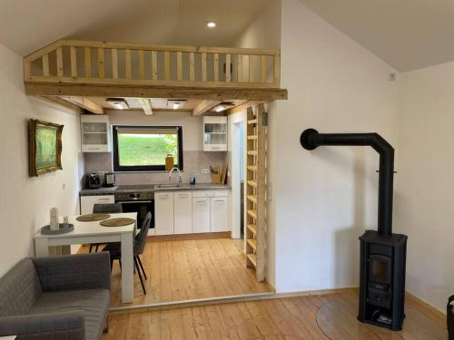 a kitchen with a table and a stove in a room at Appartement zur Wied in Oberlahr