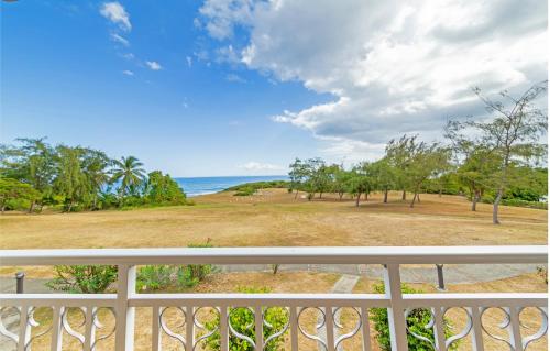 a view of the ocean from a balcony at Village Pierre & Vacances Sainte Anne in Sainte-Anne
