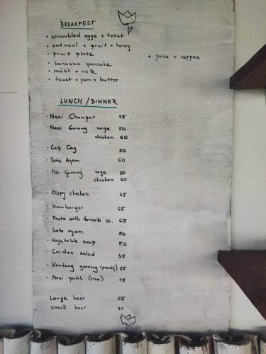 a piece of white paper with handwriting on it at Makawi Tuwa in Seraya
