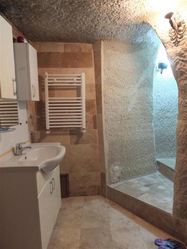 a bathroom with a shower and a sink at Anatolia cave hotel Pension in Goreme