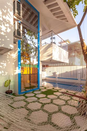 a view of a house with a mosaic floor at Cozy Nook- Artsy 3BHK with Private Pool- Lonavala By StayMonkey in Lonavala