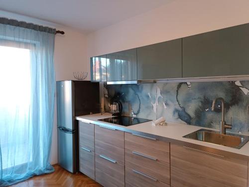 Kuchyň nebo kuchyňský kout v ubytování Apartments Villa Rossella 3