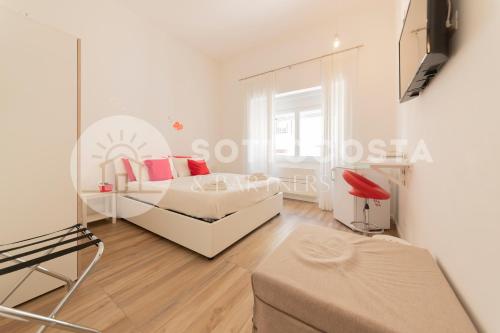 Ένα ή περισσότερα κρεβάτια σε δωμάτιο στο L'Ormeggio