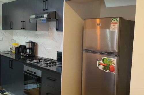 Köök või kööginurk majutusasutuses Armonia 2 Bdrm Apt/Gym/Poolview/Wi-Fi/Netflix