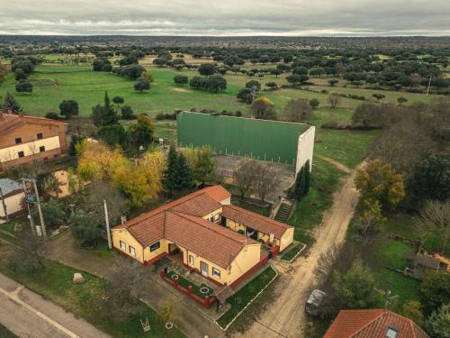 an overhead view of a house with a green building at HOSTEL LA CABAÑUELA in Monleras