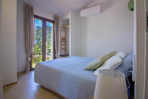 Ένα ή περισσότερα κρεβάτια σε δωμάτιο στο Villaggio Sa Luna Country Apt with Garden&Parking!