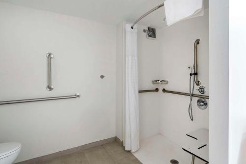 a bathroom with a shower and a toilet at MainStay Suites Lexington I-75 in Lexington