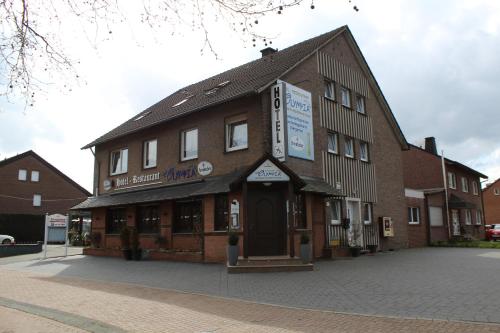 a building on the corner of a street at Hotel-Restaurant Olympia in Selm