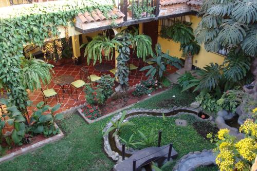 a model of a garden in front of a building at Hotel Las Camelias Inn by AHS in Antigua Guatemala