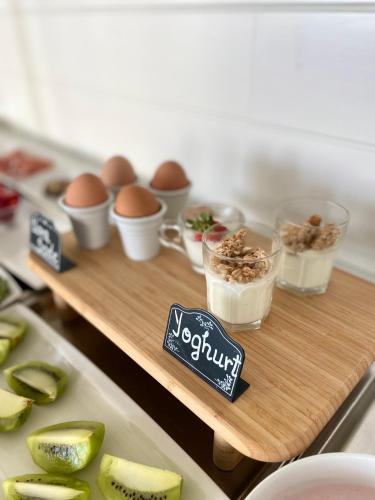 a wooden tray with eggs and other ingredients on a counter at Hotel Panorama in Cattolica