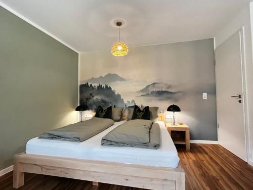 Postel nebo postele na pokoji v ubytování Ammersee Apartment Schondorf