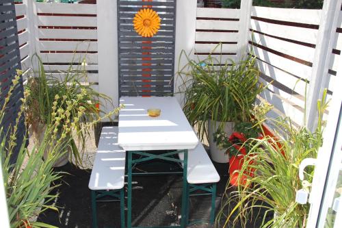 a white table and two chairs on a patio at The Light Room at no.7 in Hull