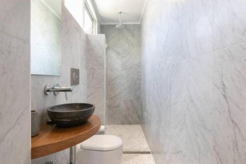 a bathroom with a sink and a toilet at CLIFFSIDE: BONDI BEACH in Sydney
