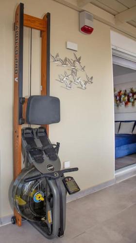 a room with a chair in the corner of a room at Sea view penthouse in Vari in Vari