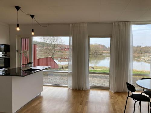 a kitchen with a view of a large window at Luxury Villa - Villa Seaside in Gothenburg