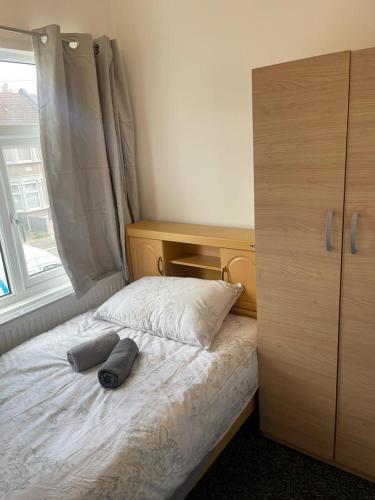 Postel nebo postele na pokoji v ubytování Rahal Ilford