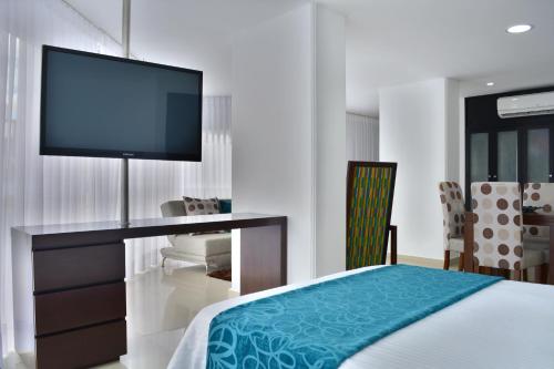 Postel nebo postele na pokoji v ubytování Monterosa Apartamentos Amoblados