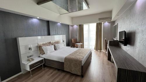 Postel nebo postele na pokoji v ubytování MOX Hotel Wellness & Spa
