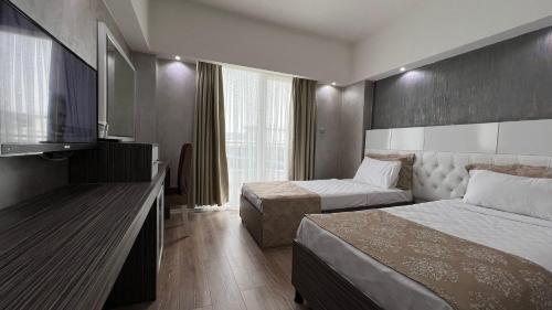 Postel nebo postele na pokoji v ubytování MOX Hotel Wellness & Spa