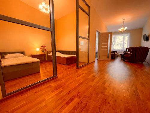 Ένα ή περισσότερα κρεβάτια σε δωμάτιο στο SPA&Hotel MŪSA PARADISE