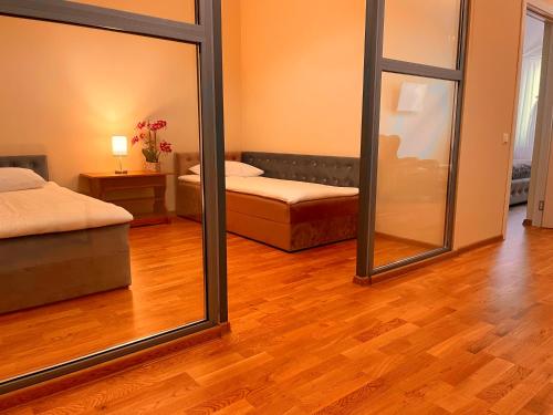 Ένα ή περισσότερα κρεβάτια σε δωμάτιο στο SPA&Hotel MŪSA PARADISE