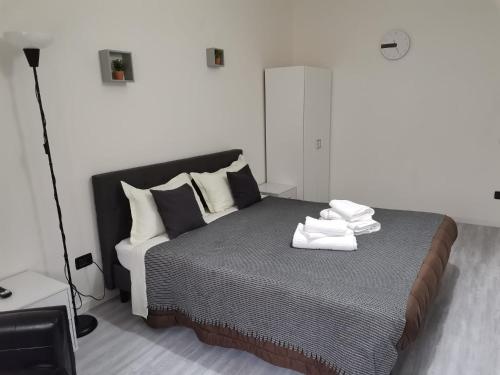 Cama o camas de una habitación en B&B Clesio & Residence Buonconsiglio Apartments